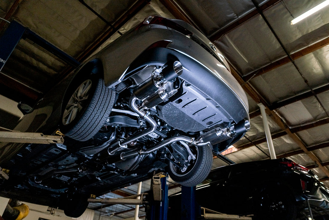 View from underneath of Lexus IS200t with ARK Performance GRiP Exhaust with Carbon Fiber Tips