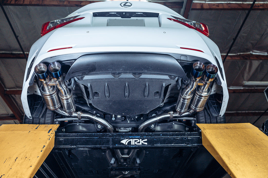 A view from underneath of a Lexus RC200T with ARK GRiP Exhaust with Burnt Tips
